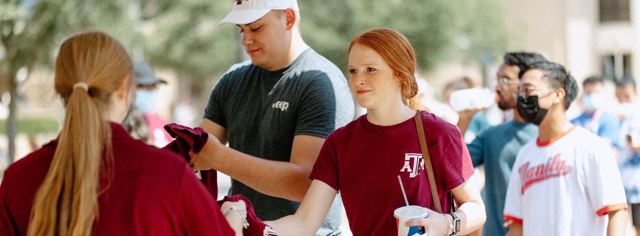 Students receiving free items at Howdy Week events